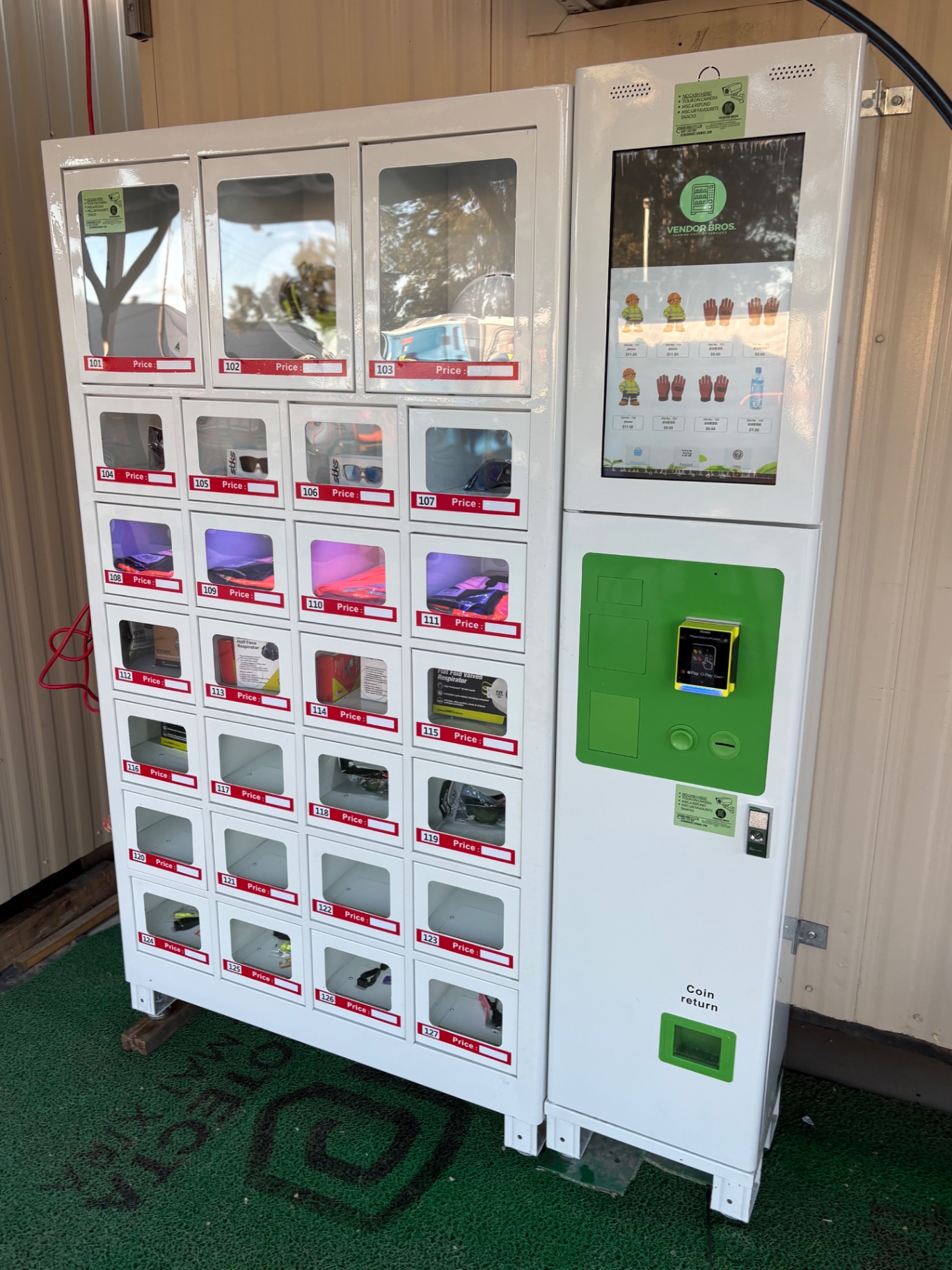 Standalone Vendor Bros. PPE vending unit with touchscreen and payment terminal